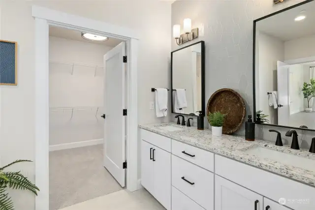 Primary bathroom with walk-in-closet.