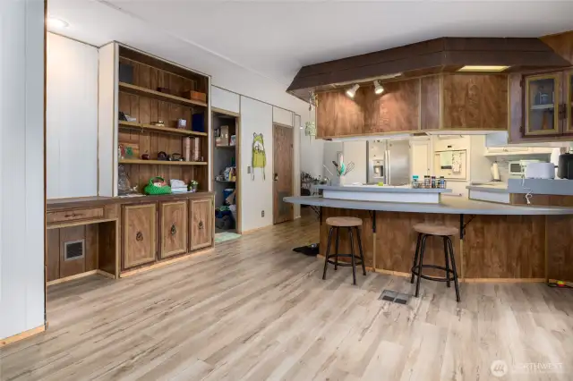 Eat-in bar at the kitchen.  Built-in desk and storage make a great little office space.