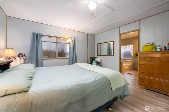 Primary bedroom, with a peekaboo view into the primary bath