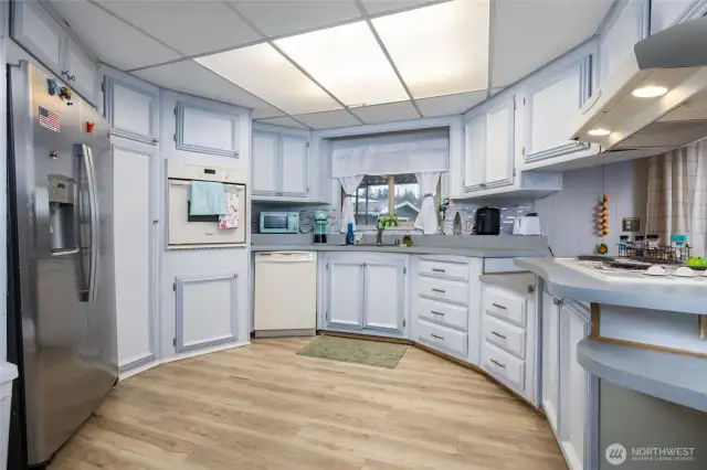 The kitchen is light and bright with fresh paint, and features lots of counter space