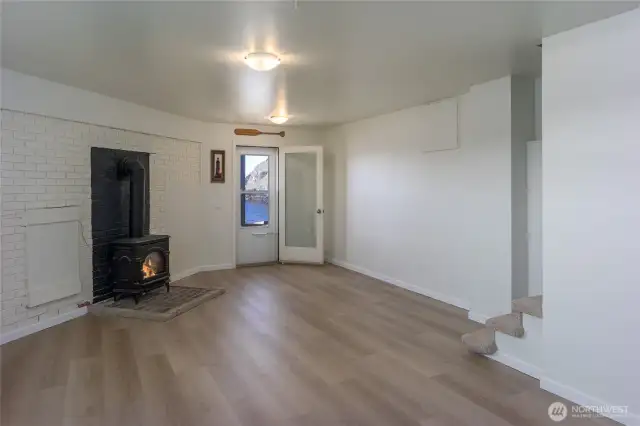Flexible daylight basement space with propane stove and separate beach access.