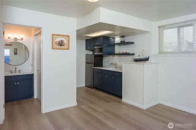 New kitchen/bath cabinets, refrigerator and counters.