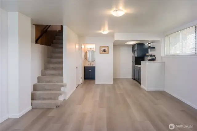 New plank floors.  Make this space a separate studio, guest area or caretaker.