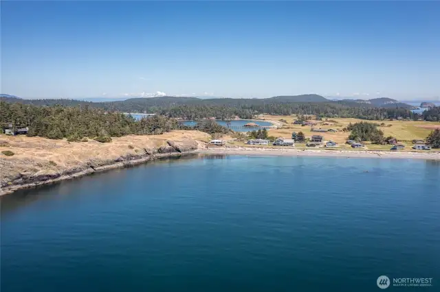 Long distance view of the neighborhood with Barlow Bay and MacKaye Harbor in the background with this home right in the middle of the picture.