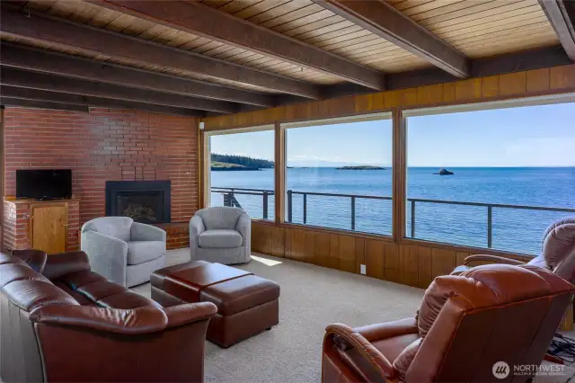 Spacious living room includes propane fireplace and views all the way to the Olympic Mountains.