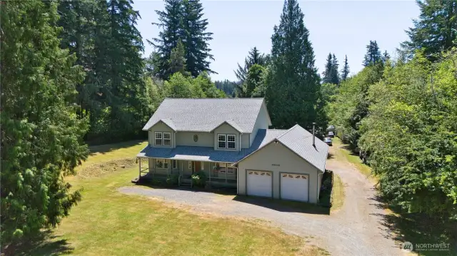 Welcome home to privacy and serenity! Surrounded by trees, fronting on a quiet country road.