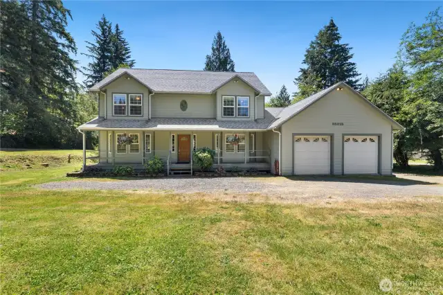 Your beautiful home sits on 1.41 acres of slightly sloping land.  Sit on your covered front porch protected from sun or rain.  It is already wired so your holiday lights come on with a flick of a switch!