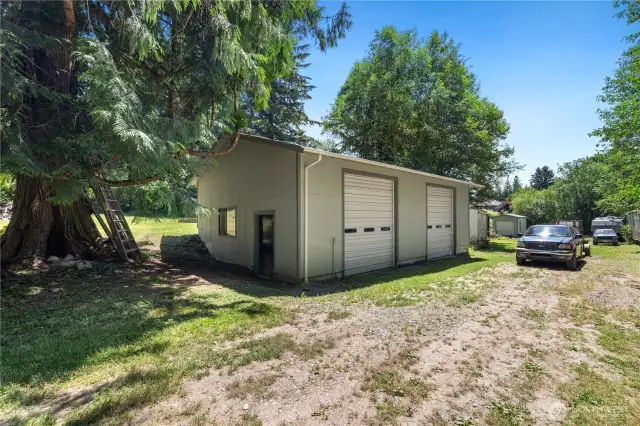 Your 1200 sf' shop has two garage doors (one 12' feet tall) plus a man door.  Wired for a generator for use in the home.  You won't lack for power or space to enjoy your hobbies, house your "toys" or manage your business.