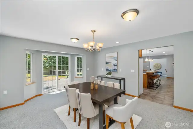 Move straight into the dining room which has plenty of space for an oversized table and easy access to the deck