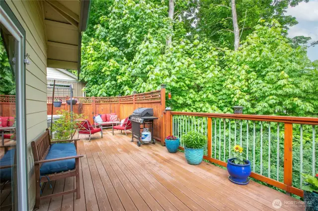 Deck off living room faces greenspace
