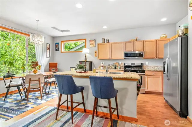 Granite homework bar in the eat-in kitchen