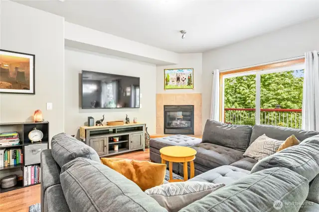 Living room with corner gas fireplace and recessed entertainment nook