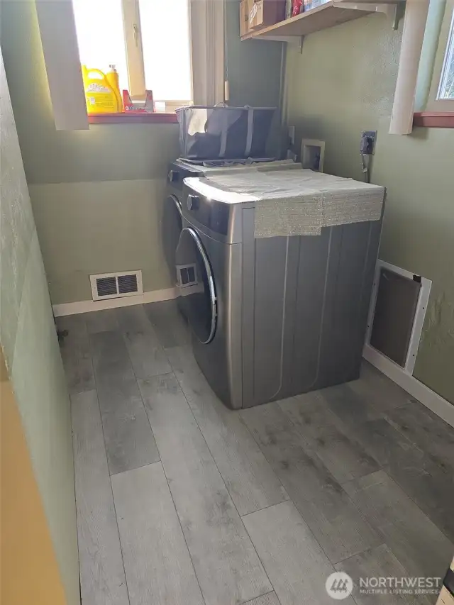 New utility room off the kitchen with new floorings.