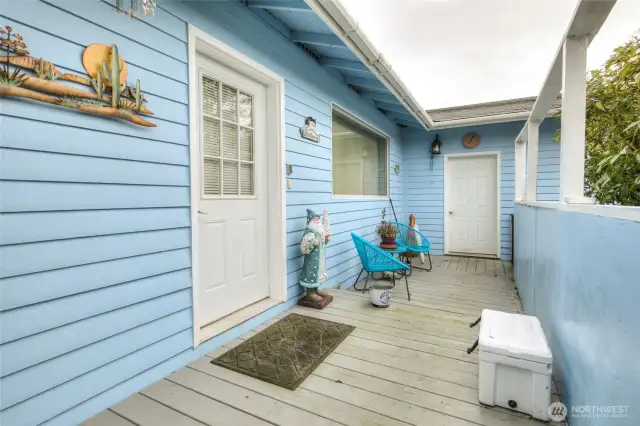 Entry into house is large deck.