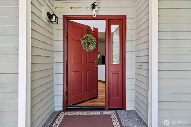 Come on in. Covered entry with a wrap around porch.
