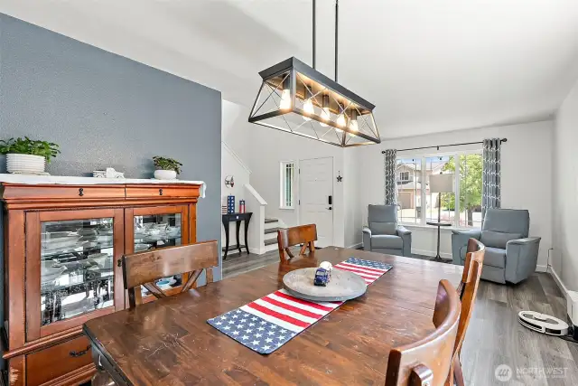 Edison bulb light fixture in Dining room. You'' notice the accent walls throughout.