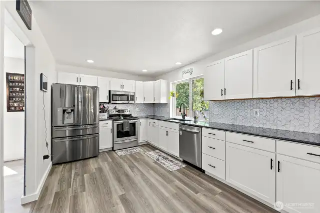 Full tile back splash and lots of cabinetry.