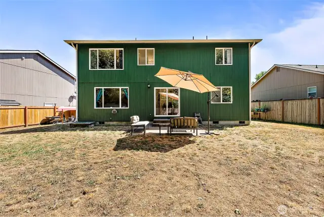Spread out in the oversized back yard, fully fenced.