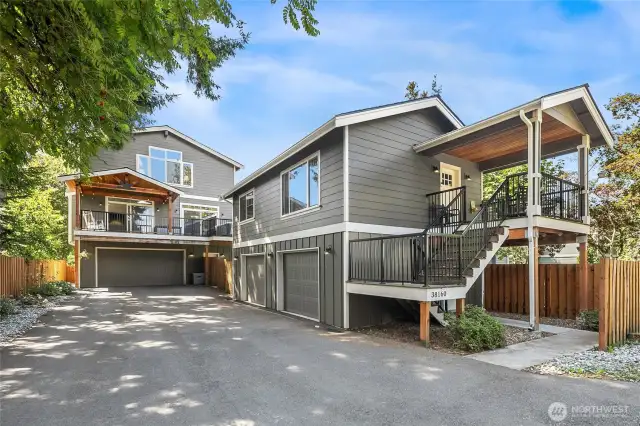 Back of home with detached ADU