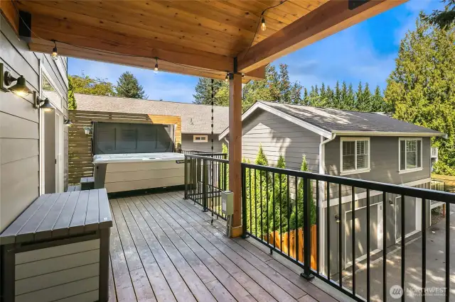 Back deck with hot tub and privacy screen