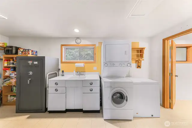 Laundry made easy with extra pantry storage and utility sink.