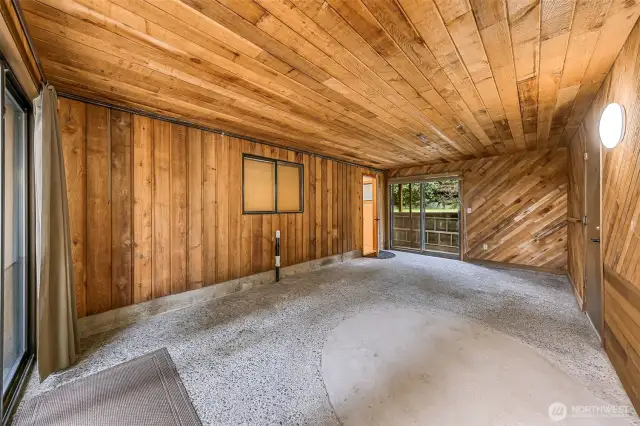 Flexible breezeway space ideal for game room, creative studio, or extra storage.