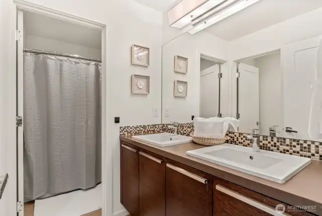 Large bathrooom with tub located upstairs just off the hall.