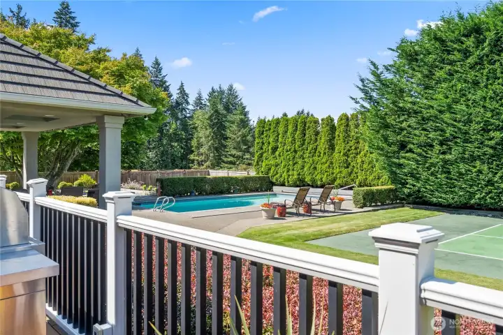 Rear deck overlooking pool and sports court