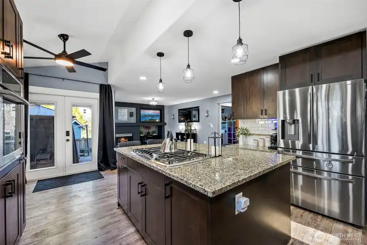 French doors off kitchen walk out to back patio space