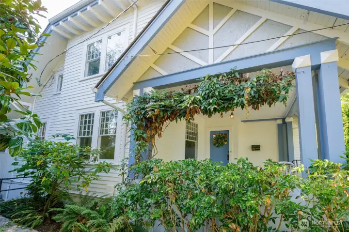 Shaded and ample front porch offers a place to watch the world go by and chat with neighbors.