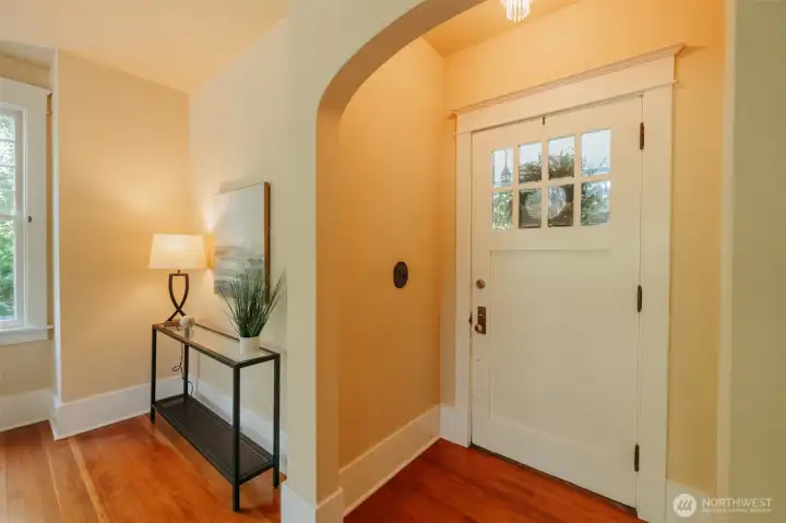 Enter through the first of many coved archways gracing the home.