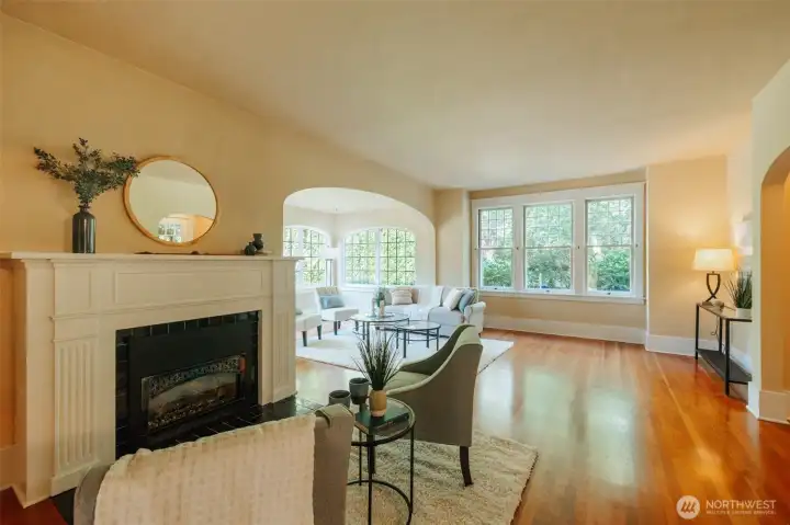 The main living room hosts cozy spaces for many moods and times. Tuck up the fire as fall settles in...