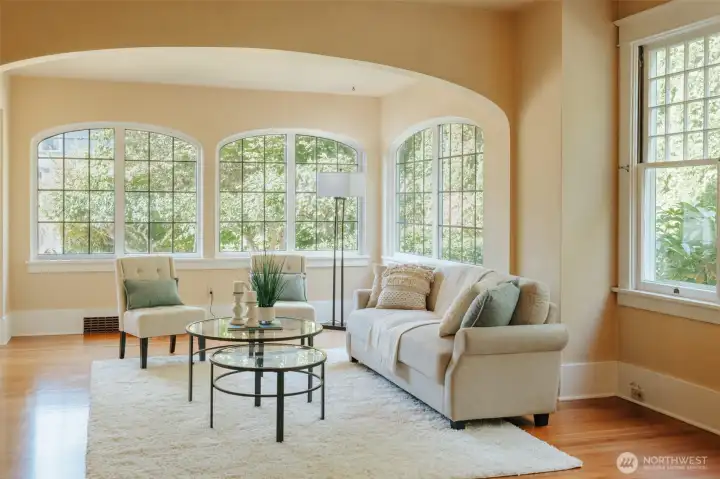 ...or bask in the afternoon light pouring into the sun room side of this generous living space.