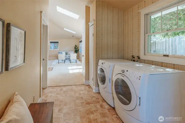 Convenient utility room space, plus a half bath adjoins here as well!