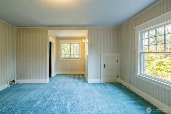First of three bedrooms --this one with windows peeking out the front of the home...