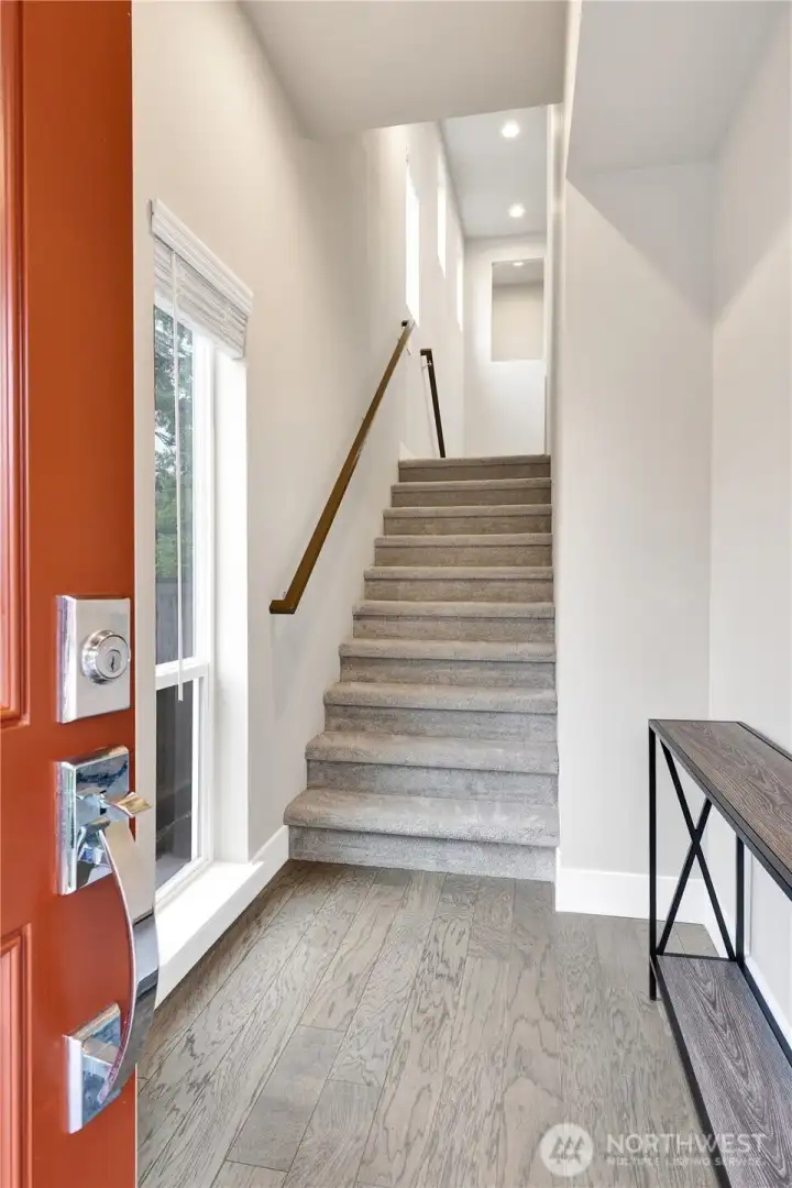 Front door entry with beautiful brand new carpet!