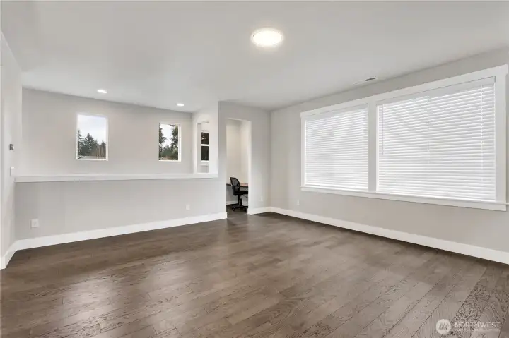 Huge great room with gas fireplace and view of bonus office nook!