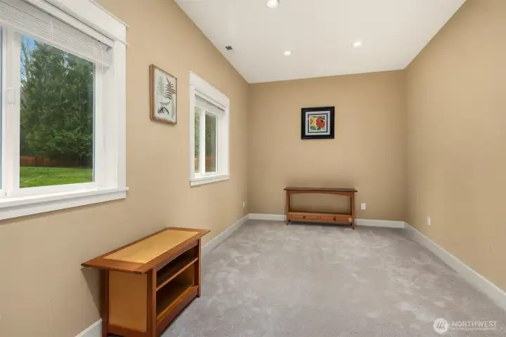 Hobby room/exercise room off garage with 3/4 bathroom across hall