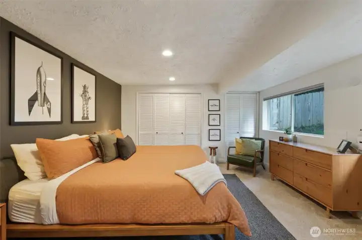 The bedroom has views of the yard and is directly across from the bathroom.