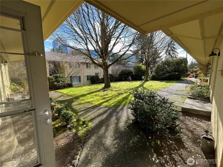 Looking out from front entrance, grass space, Children's Hospital in back ground.