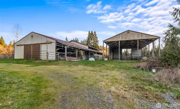 At left is an 84'x36' barn with a concrete floor.  At right is a 60'x36' structure used for hay storage.
