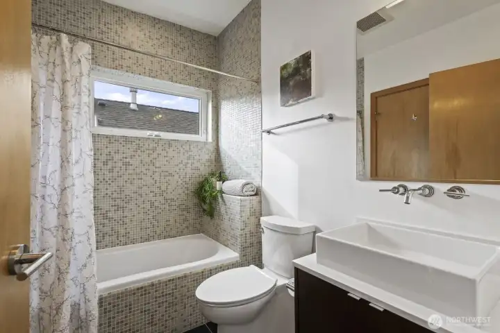Full ensuite bathroom on the upper level, which can also be accessed from the living areas.