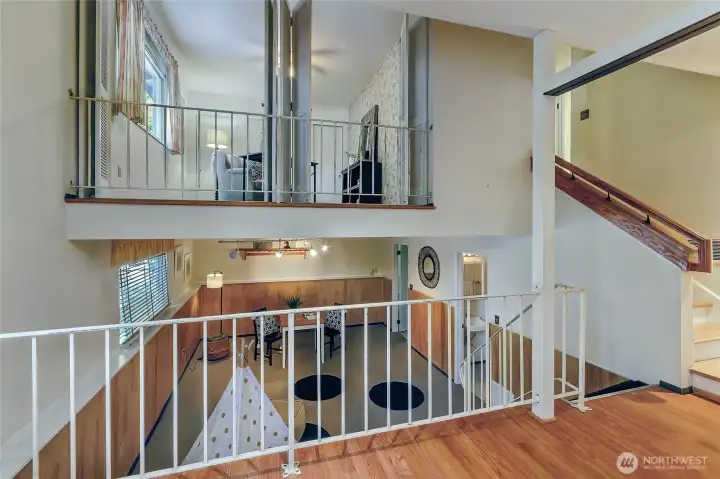 Lower bonus room and upper bedroom/office with Juliet balcony.