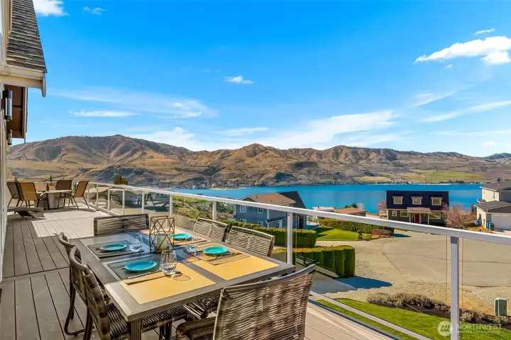 Welcome to 204 Stehekin Way in Chelan Hills, where outdoor dining on warm summer nights comes with sweeping Lake Chelan and mountain views!
