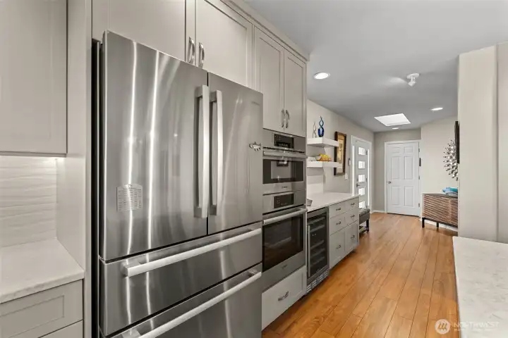 Kitchen features newer appliances, all included in the sale - even the wine fridge.