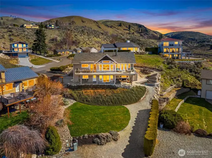 Expansive indoor-outdoor living on both levels of this Lake Chelan view home—enjoyable day and night.