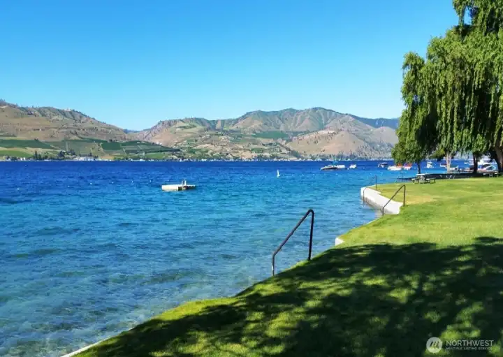 Lake Chelan Hills Willows park offers huge waterfrontage with swimming, a dock to load/unload boat passengers, lawn games, swimming area with docks, storage for kayaks and paddleboards, and day slips for boats.