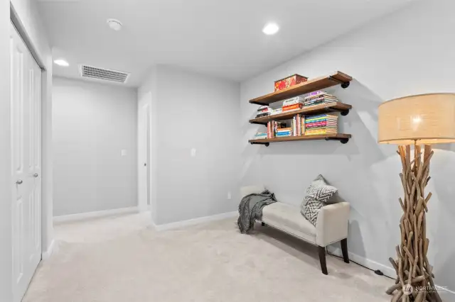 Endless options for this space at the top of the stairs, which includes a closet.
