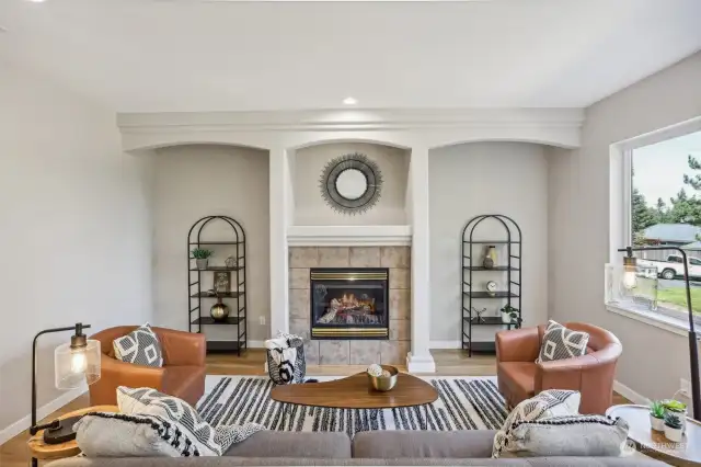 Cozy great room has gas fireplace and is open to the kitchen