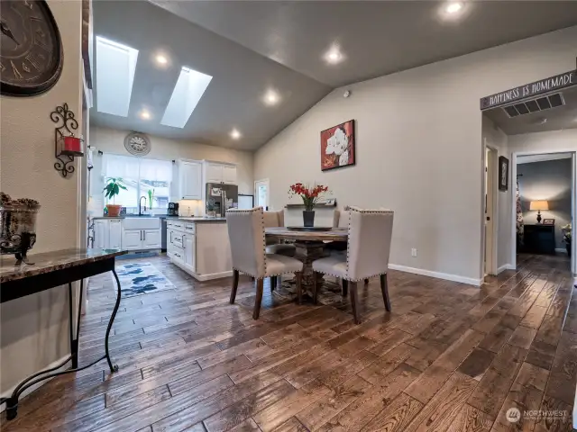 Open Floor Plan with vaulted ceilings and skylights